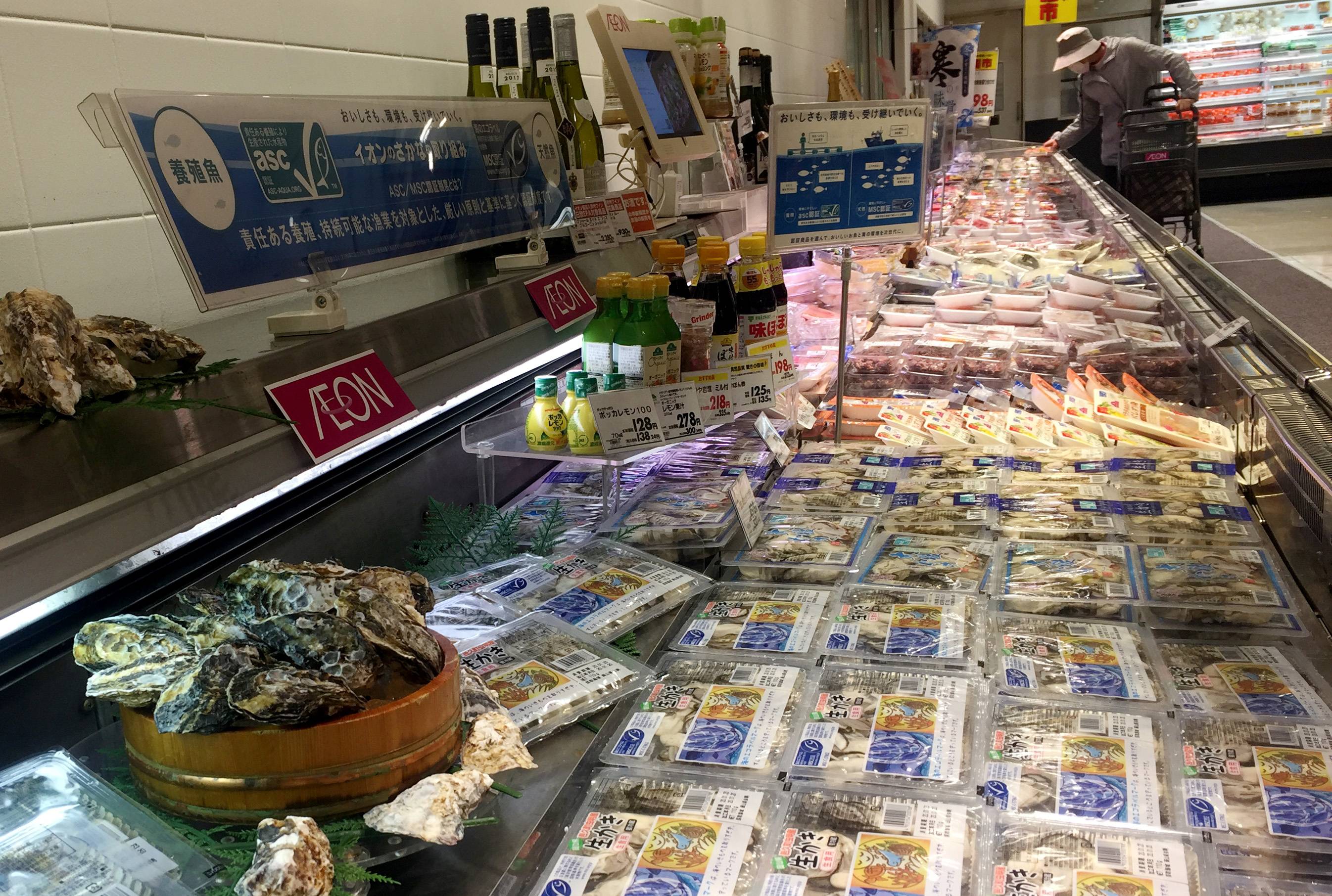 Oysters are displayed at a supermarket in Tokyo in January 2020. The ocean acidification process poses a threat to the future of the fishery and aquaculture industries, researchers say. | REUTERS