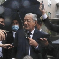 Former Malaysian Prime Minister Mahathir Mohamad visits the home of slain former Prime Minister Shinzo Abe on Friday in Tokyo.  | KYODO