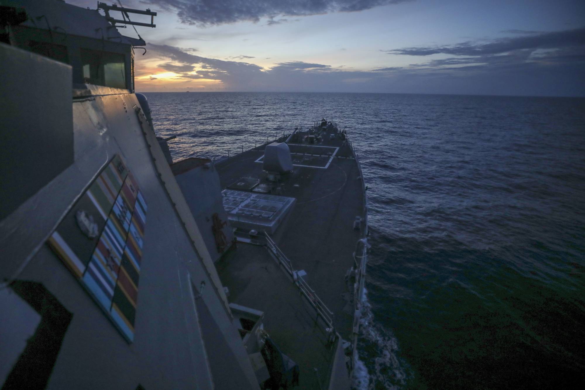 The USS Benfold guided-missile destroyer conducts routine operations in the Philippine Sea on Saturday. | U.S. NAVY