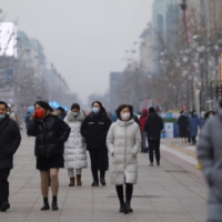 A shopping street on a smoggy day in Beijing earlier this year. In China, some domestic environmental groups have been silenced and international nongovernmental organizations are now under additional scrutiny as the result of a 2017 law. | REUTERS