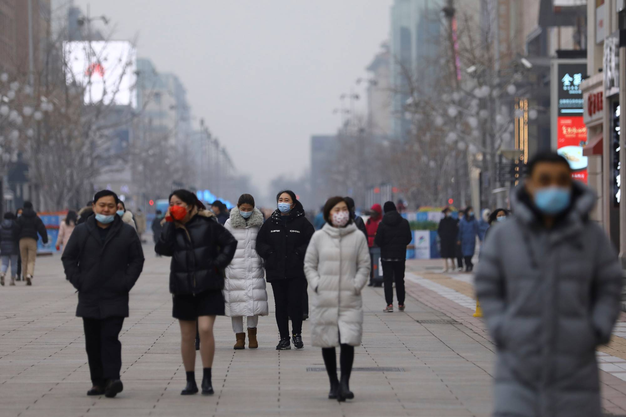 A shopping street on a smoggy day in Beijing earlier this year. In China, some domestic environmental groups have been silenced and international nongovernmental organizations are now under additional scrutiny as the result of a 2017 law. | Reuters