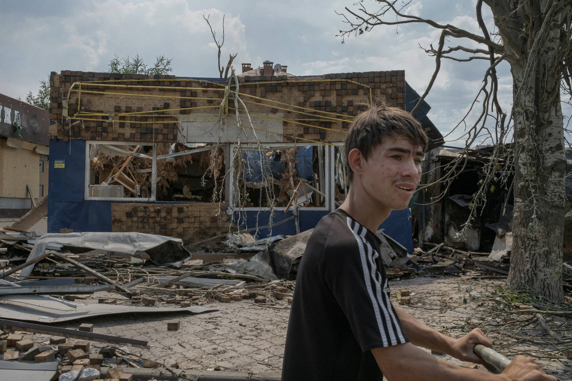 A shop hit by shelling Saturday in Bakhmut, Ukraine, on Saturday, where Russian troops are trying to advance. Ukrainian military officials said Ukrainian troops repelled an overnight assault by Russia to capture the main road link between the cities of Lysychansk and Bakhmut. | Mauricio Lima / The New York Times