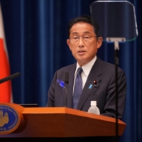 Prime Minister Fumio Kishida speaks during a news conference at the Prime Minister\'s Office on Thursday. | POOL / VIA REUTERS