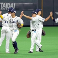The Lions celebrates after their win over the Fighters in Sapporo on Monday. | KYODO