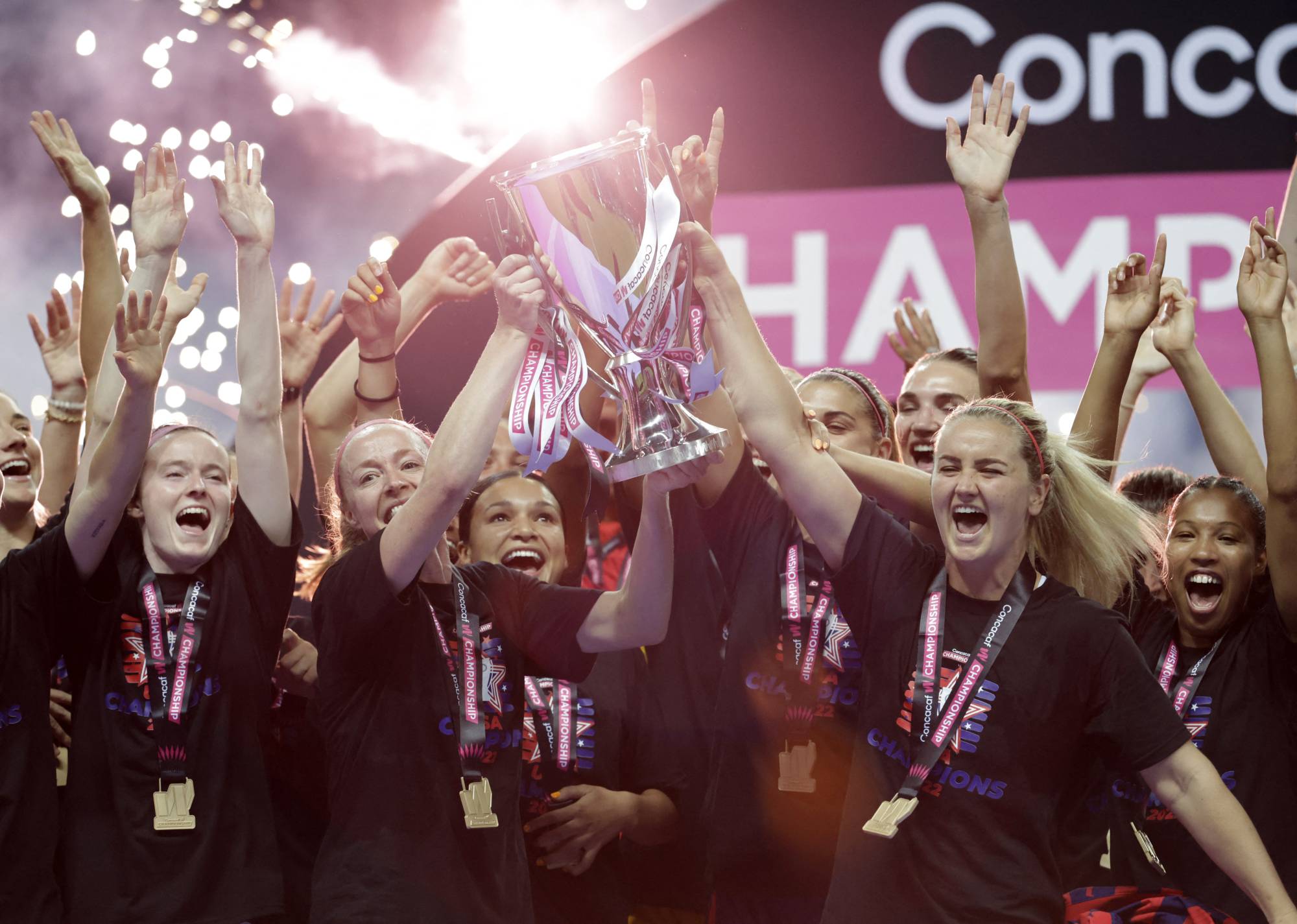 Becky Sauerbrunn (center left) of the U.S. women's national soccer team and teammates celebrate winning the CONCACAF Women's Championship on Monday. | REUTERS