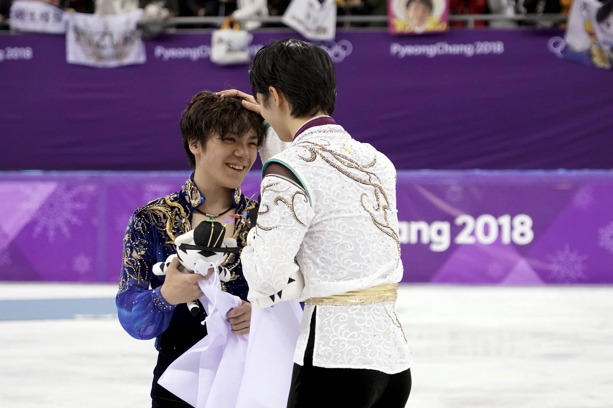Hanyu (right) and Shoma Uno celebrate after winning gold and silver in the men’s singles competition at the 2018 Winter Olympics in Pyeongchang, South Korea. | Chang W. Lee / The New York Times