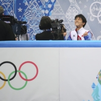 Yuzuru Hanyu reacts after hearing his score of 101.45 in the men\'s figure skating short program at the 2014 Winter Olympics in Sochi, Russia. | CHANG W. LEE / THE NEW YORK TIMES