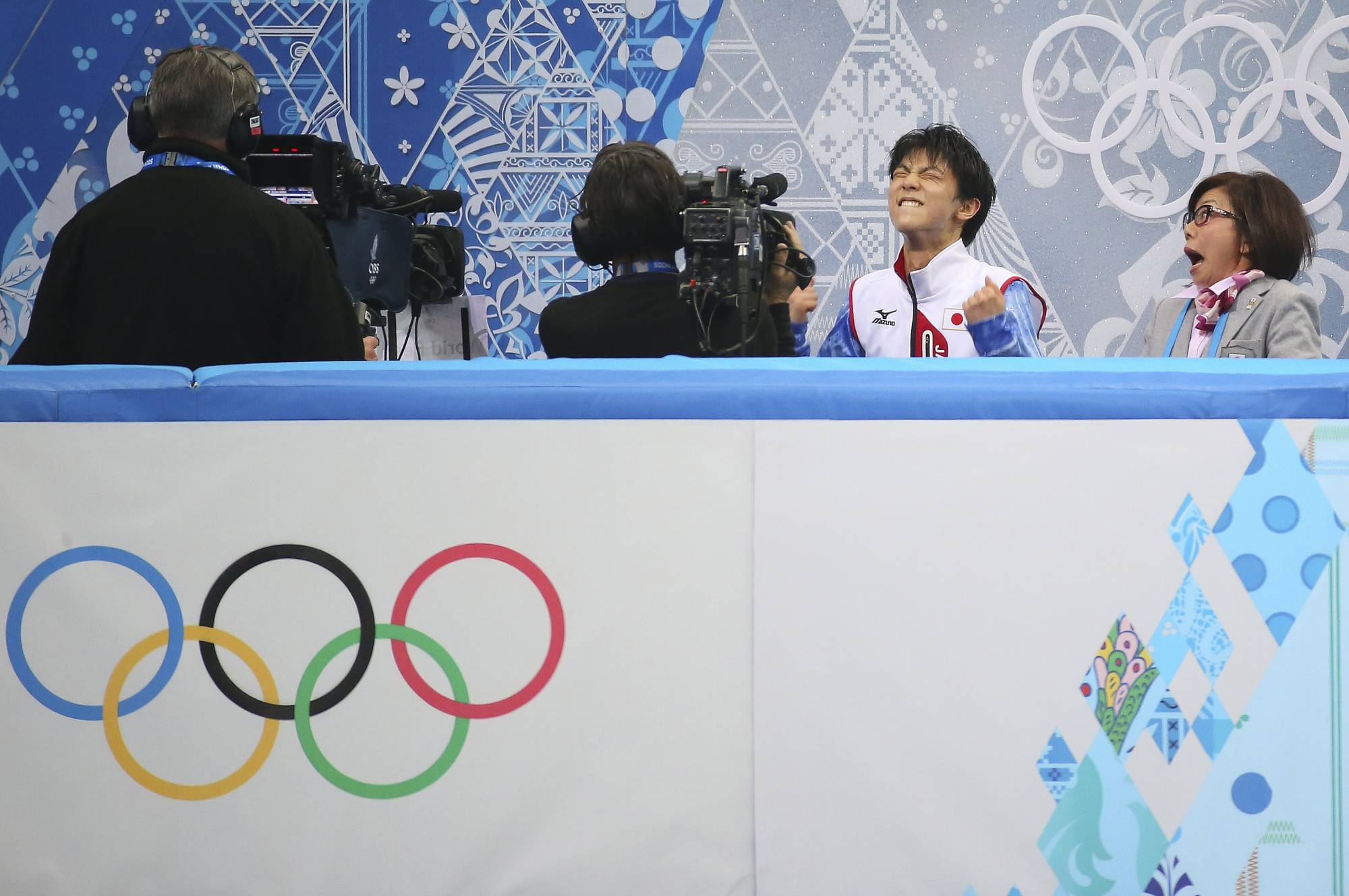 Yuzuru Hanyu reacts after hearing his score of 101.45 in the men's figure skating short program at the 2014 Winter Olympics in Sochi, Russia. | Chang W. Lee / The New York Times