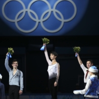 Hanyu celebrates after winning Japan\'s first men’s singles figure skating gold at the 2014 Winter Olympics in Sochi, Russia. | CHANG W. LEE / THE NEW YORK TIMES