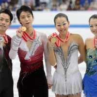 From left: Daisuke Takahashi, Yuzuru Hanyu, Mao Asada and Akiko Suzuki pose for photos following their medal-winning performances at the 2012 NHK Trophy in Rifu, Miyagi Prefecture. | KYODO
