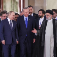 Russian President Vladimir Putin, Iranian President Ebrahim Raisi and Turkish leader Recep Tayyip Erdogan arrive for a news conference in Tehran on Tuesday. | TURKISH PRESIDENTIAL PRESS OFFICE / VIA REUTERS