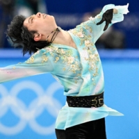 Yuzuru Hanyu competing in the men\'s single free skating during the figure skating event during the Beijing 2022 Winter Olympic Games on Feb. 10. Hanyu retired from competition aged 27 on Tuesday. | AFP-JIJI