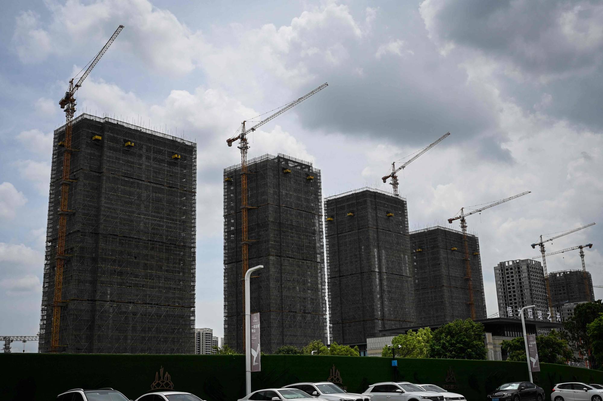 Evergrande residential buildings under construction in Guangzhou. One group of small businesses and suppliers has circulated a letter online saying they will stop repaying debts after Evergrande’s cash crisis left them out of pocket. | AFP-JIJI