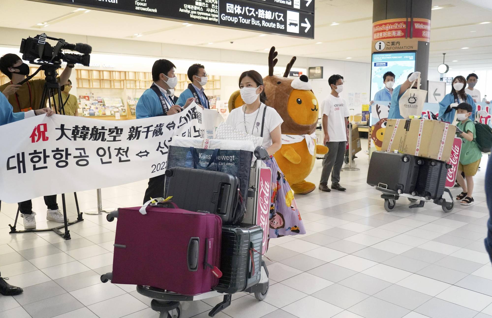 Passengers arrive at New Chitose Airport near Sapporo on Sunday, after international flights resumed at the airport for the first time in more than two years. | KYODO