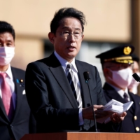 Prime Minister Fumio Kishida speaks during a visit to the Ground Self-Defense Force\'s Camp Asaka in Tokyo last November.  | POOL / VIA REUTERS