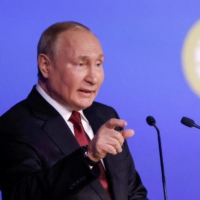 Russian President Vladimir Putin delivers a speech during a session of the St. Petersburg International Economic Forum (SPIEF) in St. Petersburg on June 17. | REUTERS