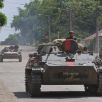 Pro-Russian forces ride an infantry fighting vehicle in the city of Lysychansk in Ukraine\'s Luhansk region on July 4. | REUTERS