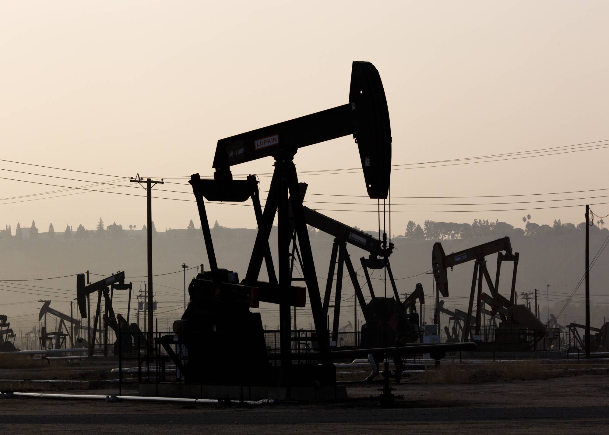 Pump jacks operating in Bakersfield, California. Green groups have long warned that offsets should not be used by businesses as a substitute for climate action like switching to renewable energy supplies or using less carbon-intensive production methods. | Alex Welsh / The New York Times 