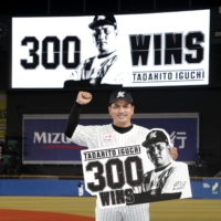 Marines manager Tadahito Iguchi poses after winning his 300th game in Chiba on Thursday. | KYODO