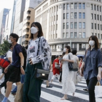 Tokyo reported 28,112 new cases of COVID-19 on Sunday. | KYODO