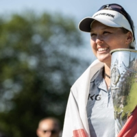 Brooke Henderson celebrates with the trophy after winning the Evian Championship in Evian-les-Bains, France, on Sunday. | AFP-JIJI