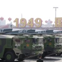 Military vehicles carrying hypersonic DF-17 missiles travel past Beijing\'s Tiananmen Square during a military parade on Oct. 1, 2019, marking the 70th founding anniversary of People\'s Republic of China. | REUTERS