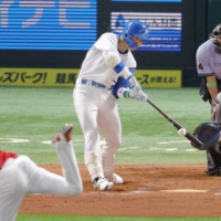 Fighters infielder Kotaro Kiyomiya, playing for the Pacific League, hits a walk-off home run in the ninth inning during the NPB All-Star Game in Fukuoka on Monday. | KYODO