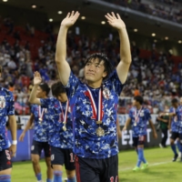 Yuki Soma celebrates after Japan won the EAFF E-1 Championship with a 3-0 rout Wednesday of defending champions South Korea in their final match of the four-team tournament at Toyota Stadium in Aichi Prefecture. | REUTERS