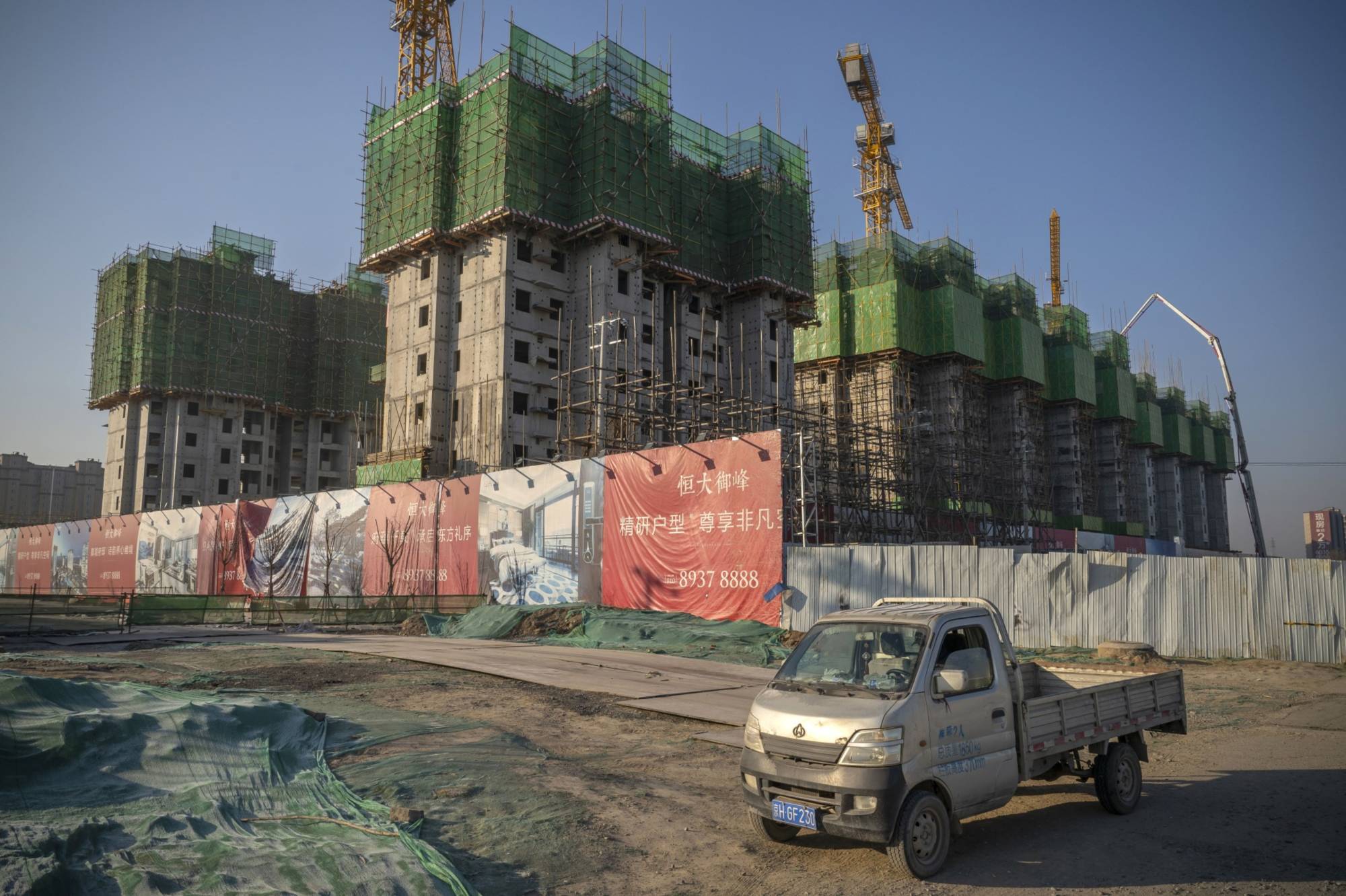 An unfinished apartment construction site of a China Evergrande Group in Beijing  | BLOOMBERG
