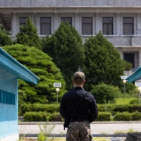 A South Korean soldier stands guard at the truce village in Panmunjom in the Demilitarized Zone that separates the two Koreas. Recent South Korean advancements are not only geared toward bolstering deterrence but also gaining crucial technological advantages over Pyongyang. | BLOOMBERG 