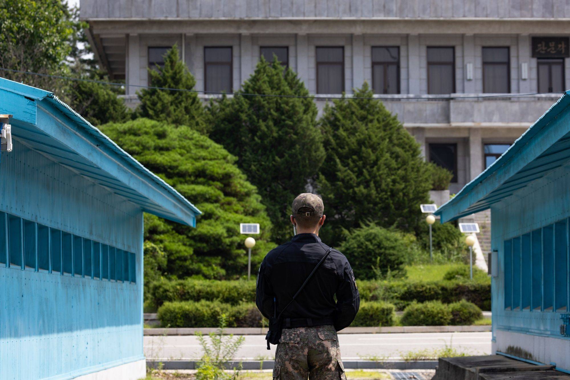 A South Korean soldier stands guard at the truce village in Panmunjom in the Demilitarized Zone that separates the two Koreas. Recent South Korean advancements are not only geared toward bolstering deterrence but also gaining crucial technological advantages over Pyongyang. | Bloomberg 