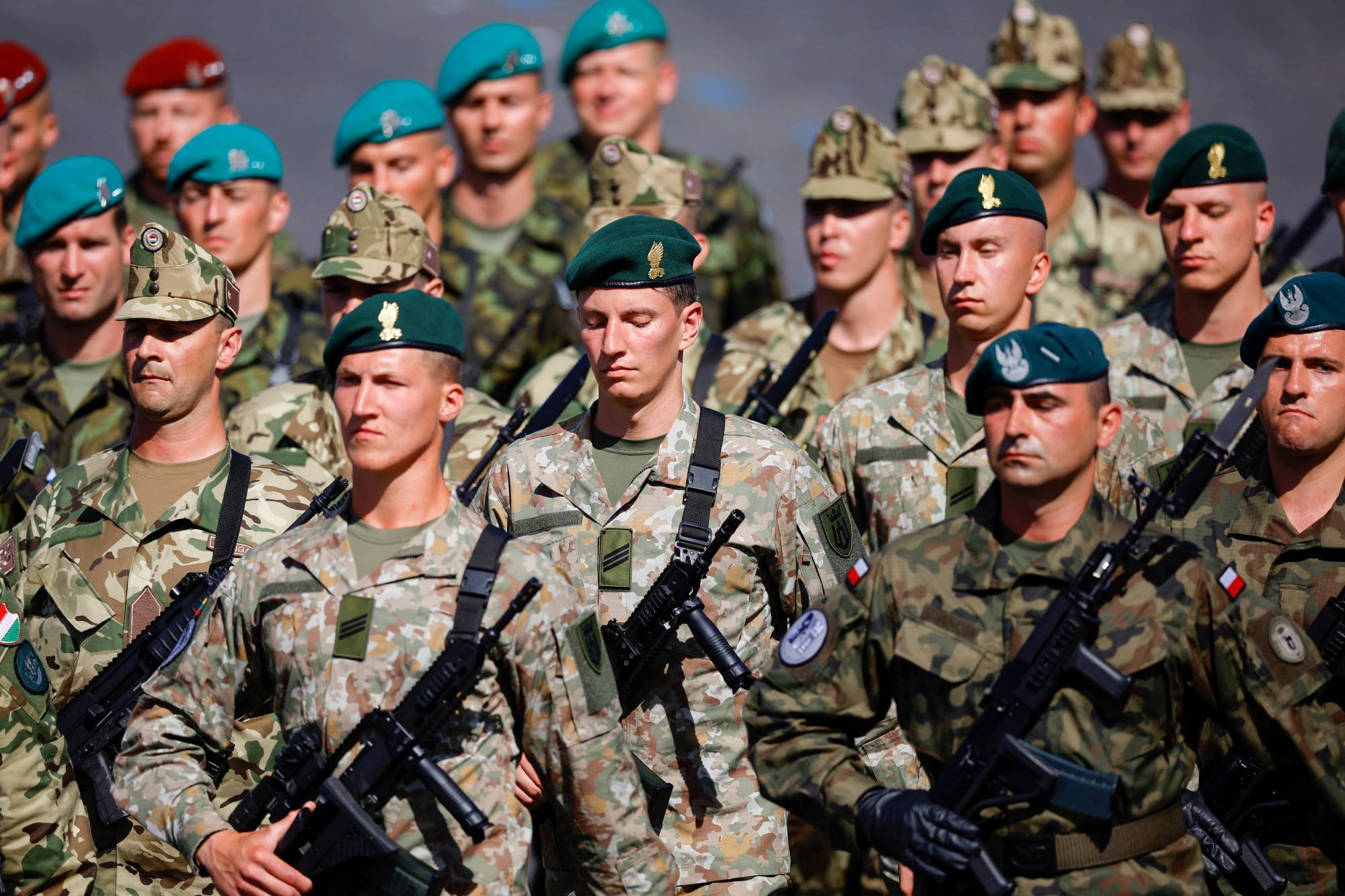 Troops from Poland, Hungary, Lithuania and the Czech Republic take part in a military parade in Paris on July 14. Seoul — which is developing closer ties with NATO — will probably also seek to export weapons to European and Asian countries that have distanced themselves from Russia after the Ukraine invasion. | Reuters