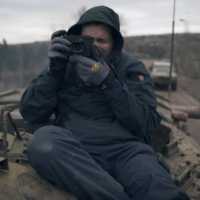 The 2016 documentary “Peace to You All” is a mix of stark black-and-white photographs and live footage from the conflict in Ukraine’s eastern Donbas region, with Juraj Mravec Jr. acting as the interviewer and photographer and his father, Juraj Mravec Sr., serving as the cameraman.  | © ALL4FILMS, S.R.O, PUNKCHART FILMS, S.R.O., RTVS ROZHLAS A TELEVíZIA SLOVENSKA
