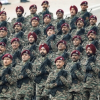 Indian soldiers march during a parade in New Delhi on Jan. 26. The country\'s latest procurements are another example of New Delhi’s “Make in India” initiative, which is designed to reduce the country’s defense imports. | REUTERS