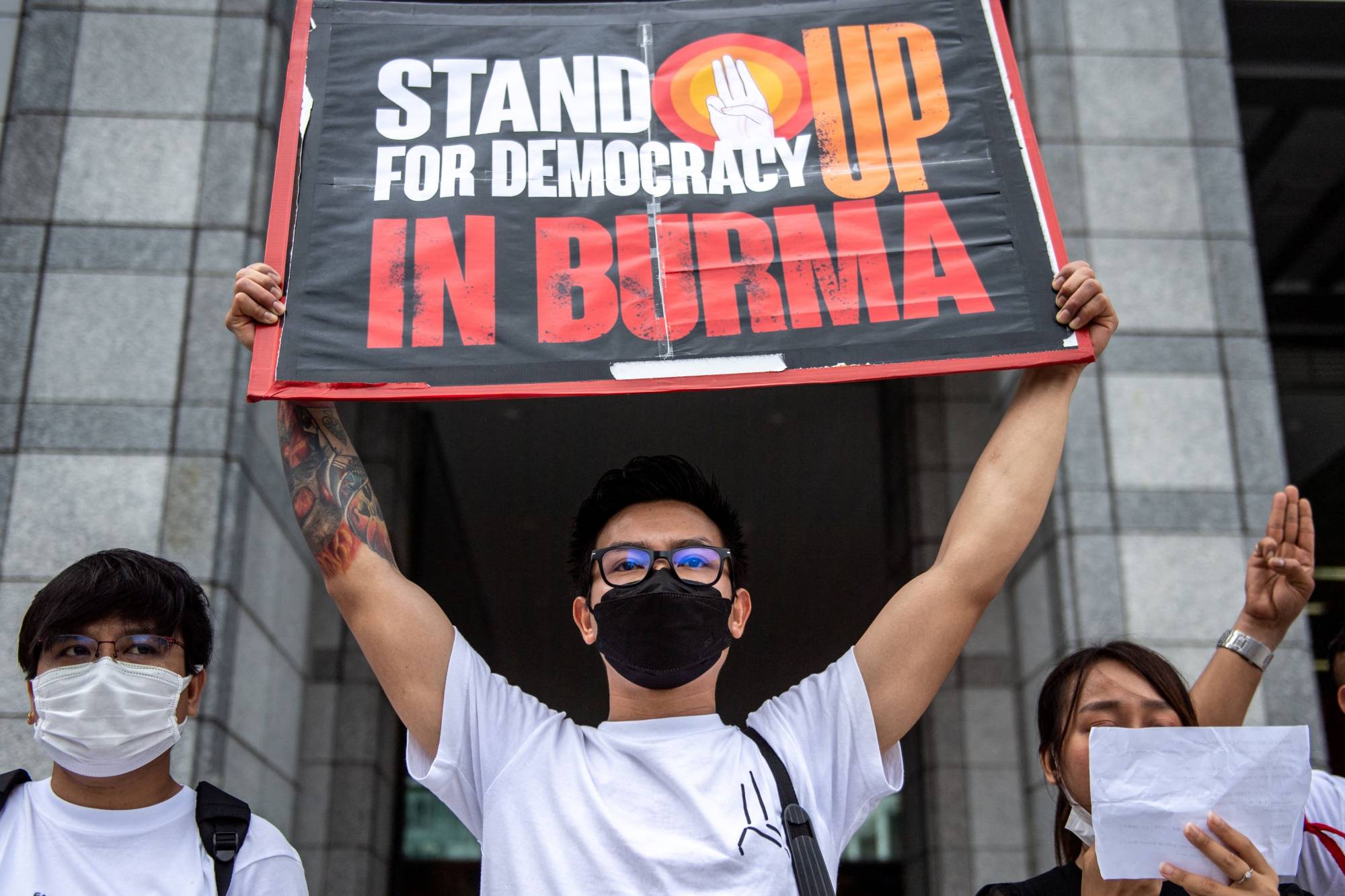 Demonstrators protest against Myanmar's execution of four pro-democracy activist at a rally outside the United Nations University in Tokyo on Tuesday. | AFP-JIJI