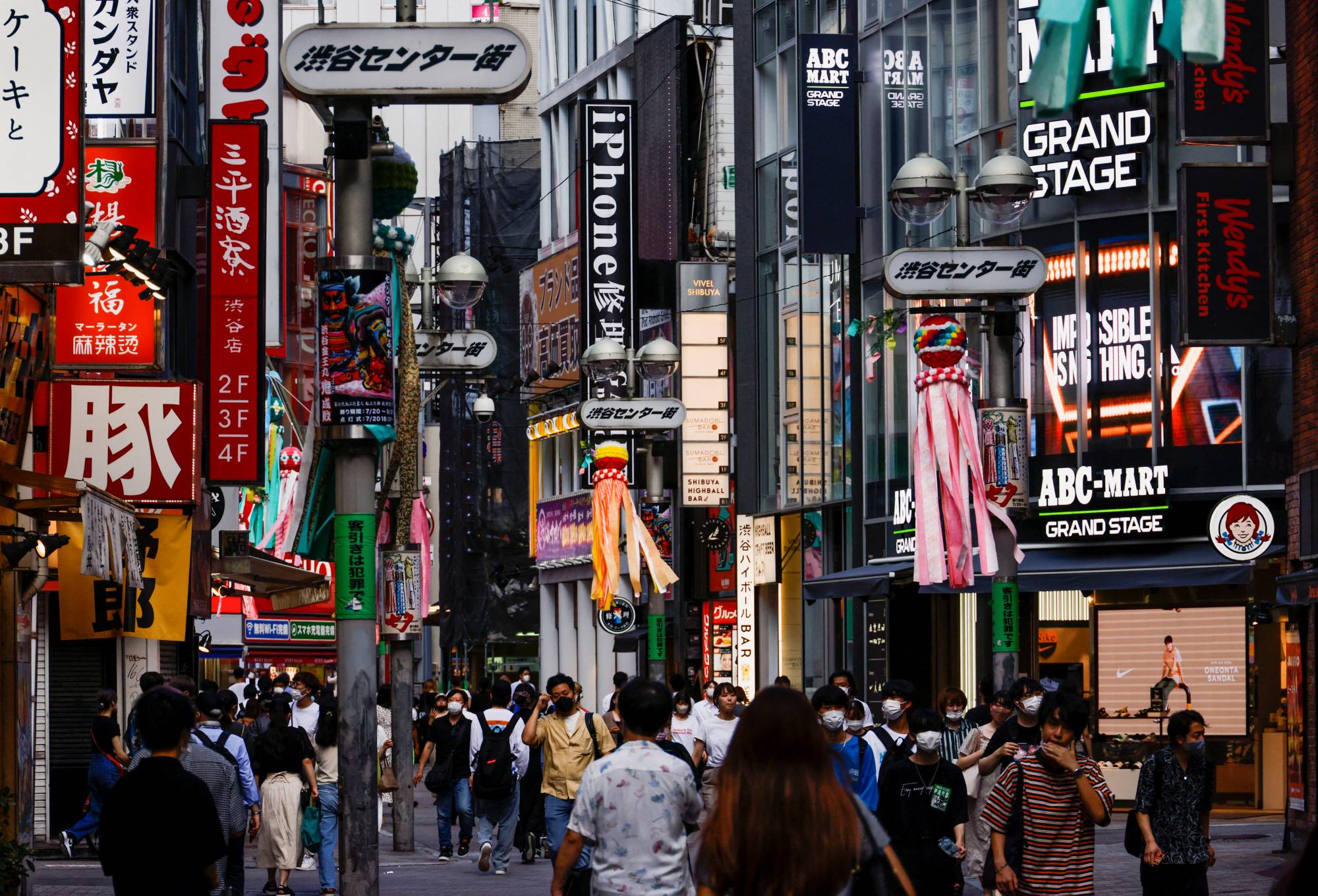 Tokyo's bustling Shibuya Ward on Thursday. Recent government moves to curb COVID-19 infections are not meant to restrict people’s movement or business activities, the minister in charge of the government's coronavirus response has said.  | REUTERS
