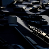 Firearms confiscated at the Windsor-Detroit border on display during a demonstration of technology that can scan truck trailers for compartments that could be used to hide guns, in Windsor, Ontario  | REUTERS
