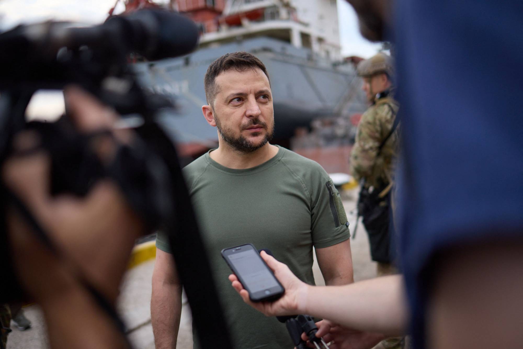 Ukraine President Volodymyr Zelenskyy speaks to reporters on Friday.  | UKRAINIAN PRESIDENTIAL PRESS SERVICE / VIA AFP-JIJI
