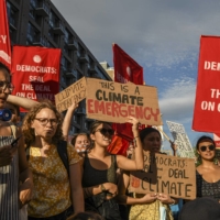 Climate activists in Washington on Thursday | KENNY HOLSTON / THE NEW YORK TIMES