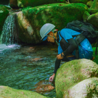 A worker performs a regular water quality check at Suntory’s Okudaisen Natural Water Sanctuary. | © SUNTORY HOLDINGS