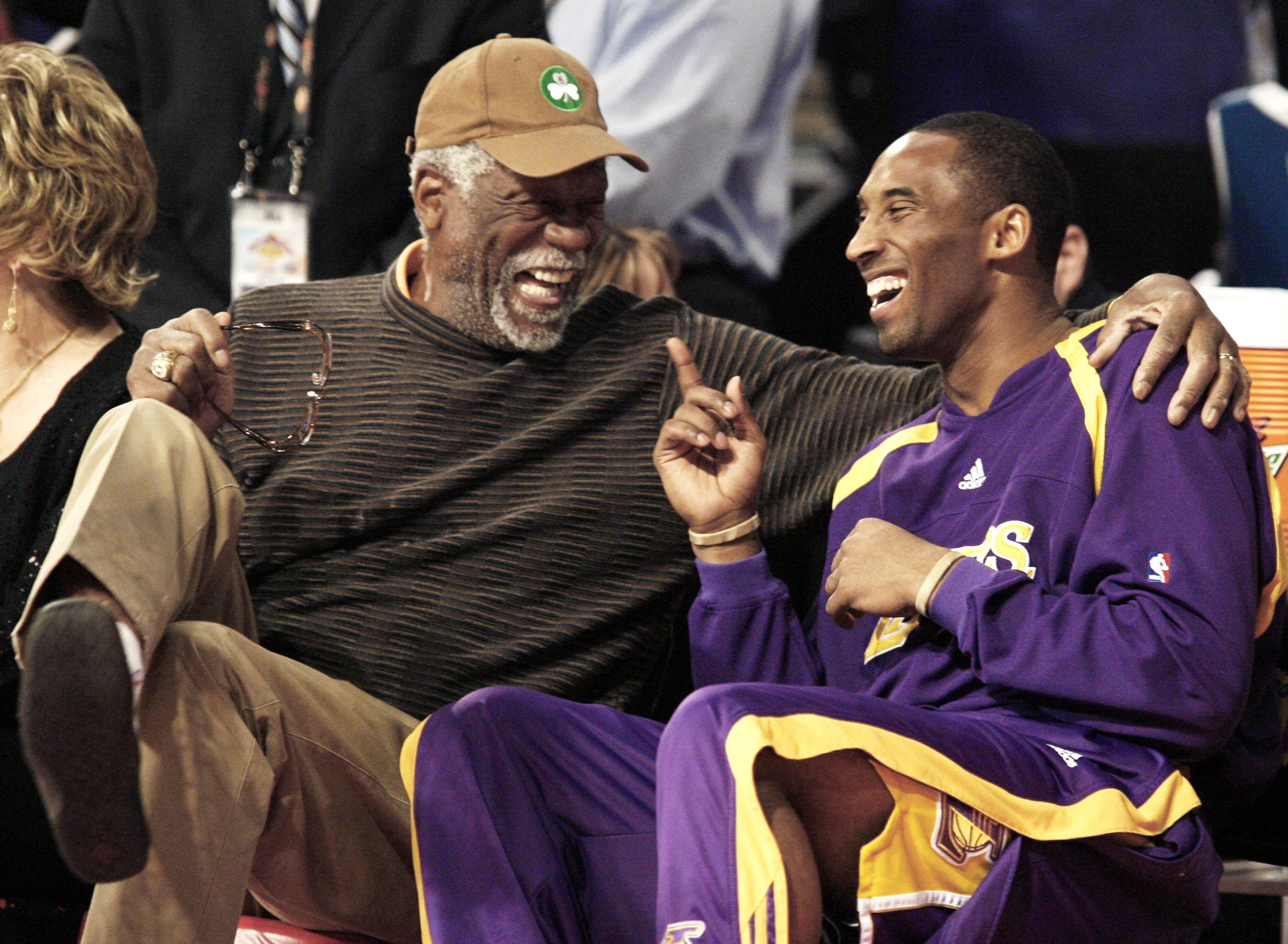 Former Celtics great Bill Russell (left) talks with Lakers guard Kobe Bryant during the NBA All-Star Slam Dunk Contest in Las Vegas in 2007. | REUTERS