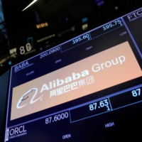 The Alibaba Group logo on the trading floor at the New York Stock Exchange in August 2021.  | REUTERS