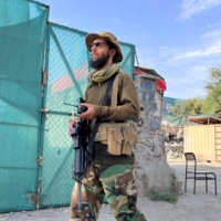 A Taliban fighter stands guard Tuesday near the site where al-Qaida leader Ayman al-Zawahri was killed in a U.S. strike over the weekend in Kabul. | REUTERS