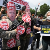A demonstration against U.S.-South Korea joint exercises, in front of the Presidential Office in Seoul on Thursday.  | REUTERS