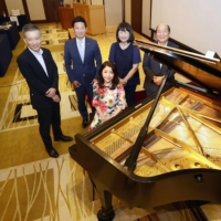 Members of the piano conservation project committee in Fukuoka on July 29 | NISHINIPPON SHIMBUN
