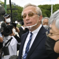 Mikhail Galuzin, Russia\'s ambassador to Japan, speaks to reporters after offering flowers at a memorial stone in the city of Hiroshima\'s Peace Park on Thursday.  | KYODO