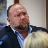 Alex Jones attempts to answer questions about his emails during trial at the Travis County Courthouse in Austin, Texas, on Wednesday. | POOL / VIA REUTERS   