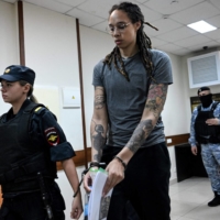 Brittney Griner leaves the courtroom before her sentencing in Khimki, Russia, on Thursday. Griner was sentenced to nine years on drug smuggling charges.  | AFP-JIJI