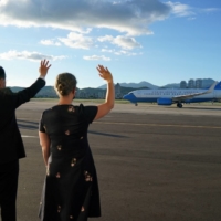 Taiwan\'s foreign minister, Joseph Wu (left), waves goodbye to the plane carrying U.S. House of Representatives Speaker Nancy Pelosi as it departs from Taipei on Wednesday. The Chinese government blasted the visit.  | TAIWAN MINISTRY OF FOREIGN AFFAIRS / VIA REUTERS 