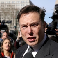 Tesla CEO Elon Musk leaves a New York court in 2019.  | REUTERS